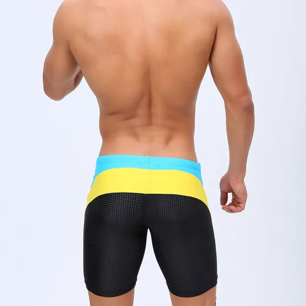 model-in-blue-black-tight-fit-swim-trunks-with-yellow-stripes.webp Blue & Black Tight Fit Swim Trunks with Yellow Stripes