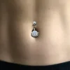 skeleton-hand-navel-ring-model.webp Stainless Steel Skeleton Hand Navel Ring