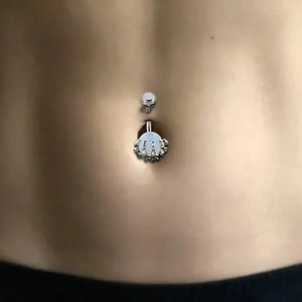 skeleton-hand-navel-ring-model.webp Stainless Steel Skeleton Hand Navel Ring
